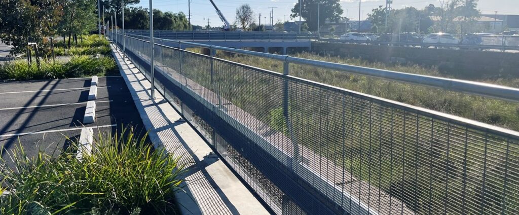 W beam RhinoStop® Standard guardrails protecting vehicle lanes.